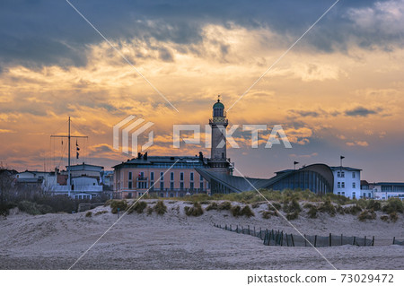 View to the Lighthouse in Warnemuende, Germany 73029472