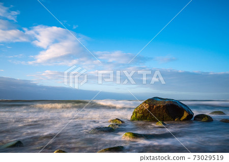 Stones on shore of the Baltic Sea near Warnemuende, Germany Stones on shore of the Baltic Sea near Warnemuende, Germany 73029519