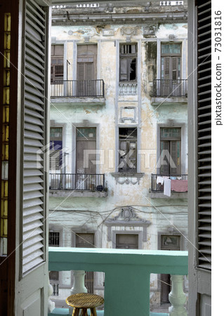 Balcony entrance with old building in background - Havana, Cuba 73031816