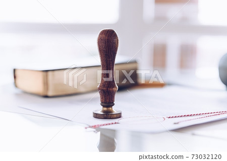 Notary stamp on a table in a notary's office. 73032120