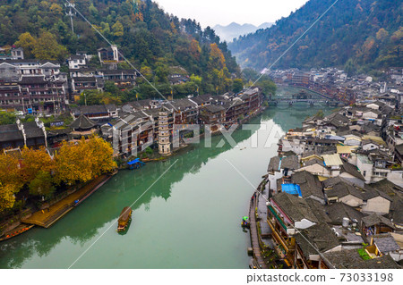 Amazing drone view of Fenghuang old town with ancient architecture Amazing drone view of Fenghuang old town with ancient architecture 73033198
