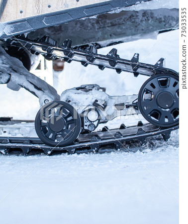 The back of the snowmobile in winter. Riding in the snow 73033535
