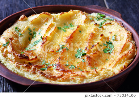 Garlic Parmesan Mashed Potato Casserole, top view Garlic Parmesan Mashed Potato Casserole, top view 73034100