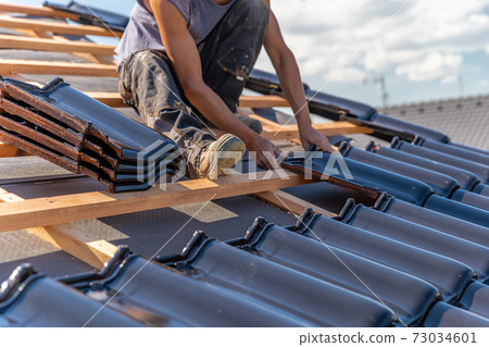 manufacture of the roof of a family house from ceramic tiles 73034601