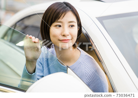 Young women in the driver's seat Young women in the driver's seat 73036471