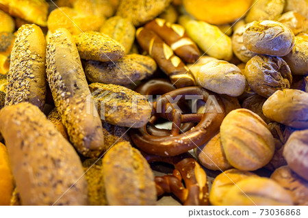 Bread, bread products close-up on a shelf in the store. Bread, bread products close-up on a shelf in the store. 73036868