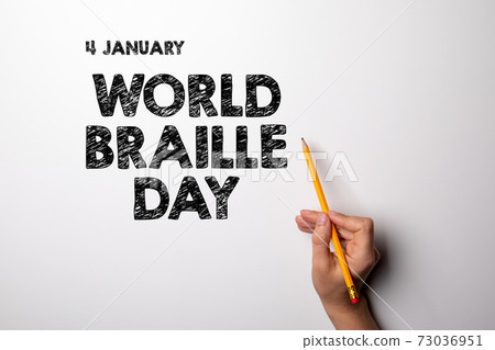 World Braille Day, 4 January. Woman's hand with a pencil World Braille Day, 4 January. Woman's hand with a pencil 73036951