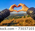 Romance and love. The girl folded her hands in the form of a heart 73037103