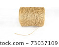 bobbin of yarn on a white background. isolated white background. 73037109