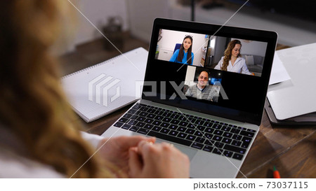 Young business woman at home office attends a video conference 73037115