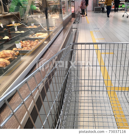 Social distance. Marking on the floor in a store, market, pharmacy 73037116