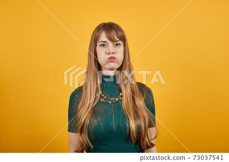 Upset offended looking big eyes, blowing cheeks being annoyed after quarrel 73037541