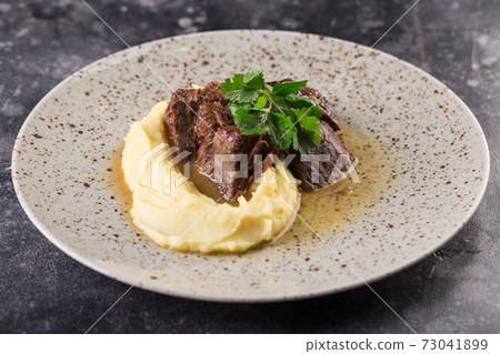 beef course with mashed potatoes and herbs. Photo for menu. beef course with mashed potatoes and herbs. Photo for menu. 73041899