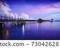 Wooden bridge at dusk 73042628