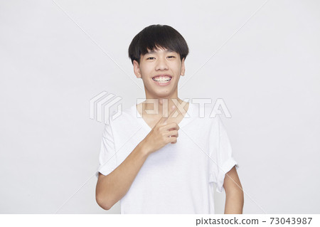 Portrait of good looking Asian man Portrait of good looking Asian man 73043987