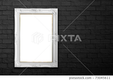 white frame on black brick wall 73045611