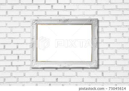 white frame on white brick wall 73045614