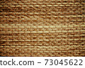 Wicker woven beige mat handmade background. 73045622