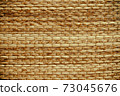 Wicker woven beige mat handmade background. 73045676