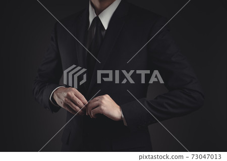 Close up shot of businessman in black suit. Close up shot of businessman in black suit. 73047013