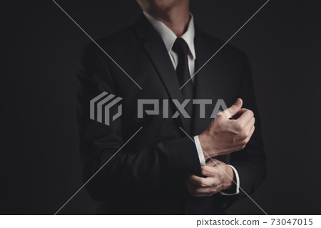 Close up shot of businessman in black suit. 73047015
