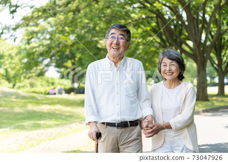 Senior couple walking Senior couple walking 73047926