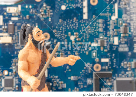 An ancient man standing in front of a computer motherboard An ancient man standing in front of a computer motherboard 73048347