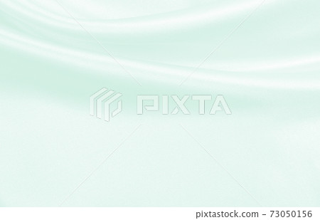 Smooth elegant green silk or satin luxury cloth texture as abstract background. Luxurious background design Smooth elegant green silk or satin luxury cloth texture as abstract background. Luxurious background design 73050156