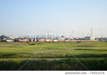 A container freight train that runs in Yokkaichi city in the early morning 73052524