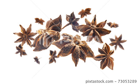 Anise stars levitate on a white background Anise stars levitate on a white background 73053289