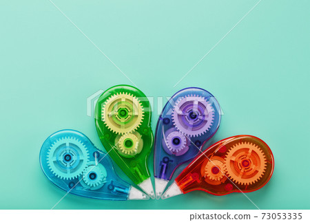 Stationery correction tapes are Multicolored on a blue background. 73053335