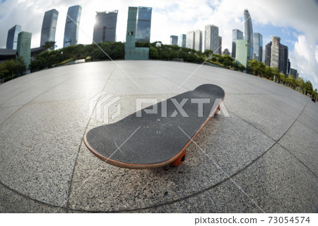Skateboard  in a modern city 73054574