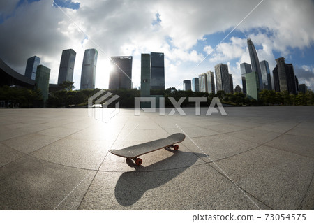 Skateboard in a modern city Skateboard in a modern city 73054575