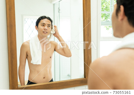 Young man after the bath 73055161