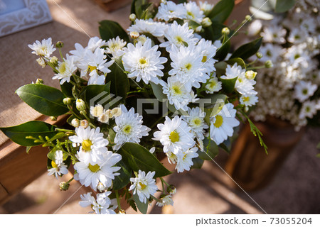 Flower arrangement at a wedding Flower arrangement at a wedding 73055204