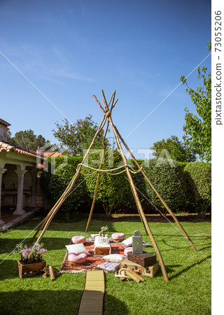 Tipi made of sticks as a wedding decoration Tipi made of sticks as a wedding decoration 73055206