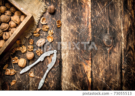 Walnuts in the box with the Nutcracker. Walnuts in the box with the Nutcracker. 73055513