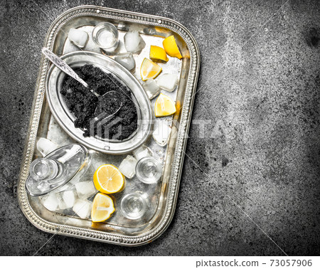 Black caviar and vodka. 73057906