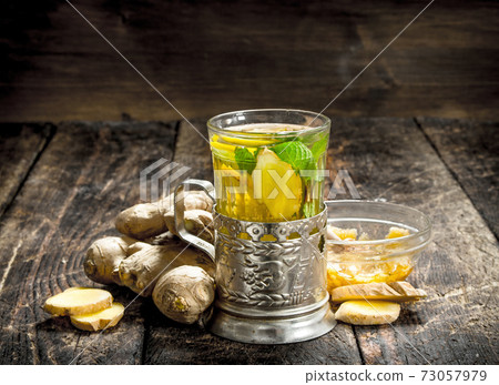 Ginger tea with mint and lemon. Ginger tea with mint and lemon. 73057979