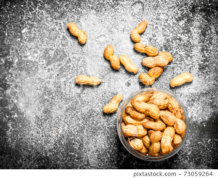 Peanuts in a bowl. Peanuts in a bowl. 73059264