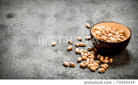 Pistachios in a bowl. Pistachios in a bowl. 73059334