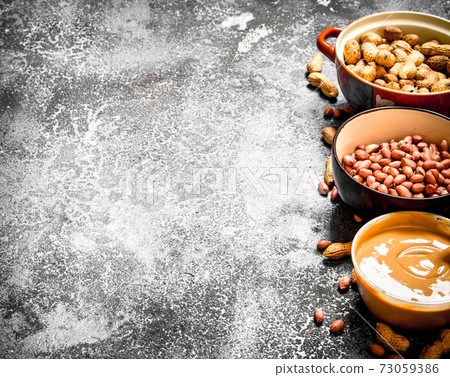 Nuts and peanut butter in a bowl. Nuts and peanut butter in a bowl. 73059386