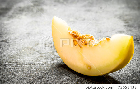 piece of fresh melon . piece of fresh melon . 73059435