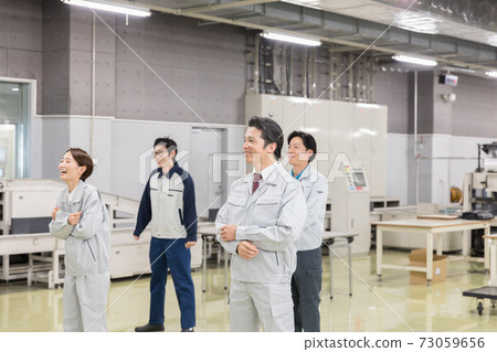 Workers doing gymnastics before work Workers doing gymnastics before work 73059656