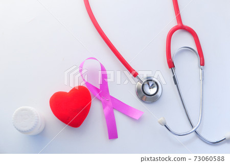 Red ribbon HIV, and stethoscope on white background. Red ribbon HIV, and stethoscope on white background. 73060588