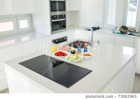 Modern kitchen in beautiful home with food ingredients 73063963