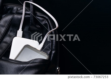 The phone and power bank in the bag The phone and power bank in the bag 73067253