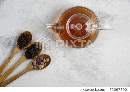 Wooden spoons with dried roses, loose teas and cloves Wooden spoons with dried roses, loose teas and cloves 73067700
