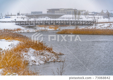 Scenic view of Oquirrh Lake in winter 73068642