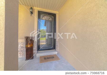 Front door and porch of modern rendered home Front door and porch of modern rendered home 73068716